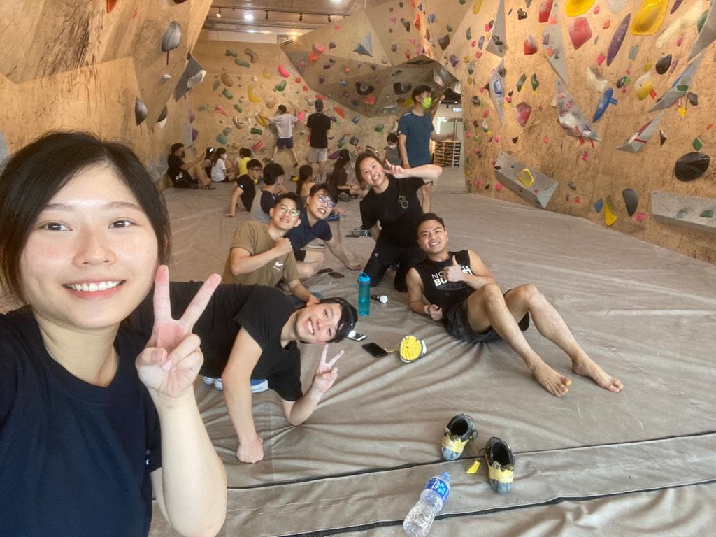 Bouldering crew chalking up at the climbing gym